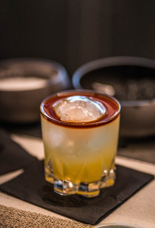 Free Glass of iced alcohol drink served on table Stock Photo