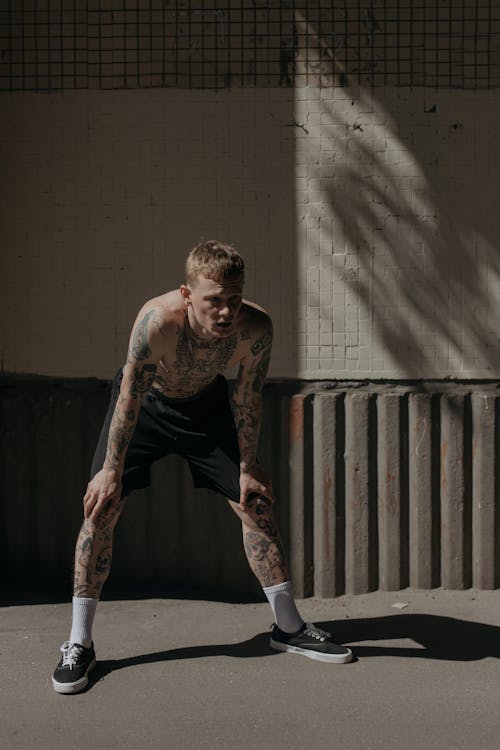 Shirtless Man with Body Tattoos