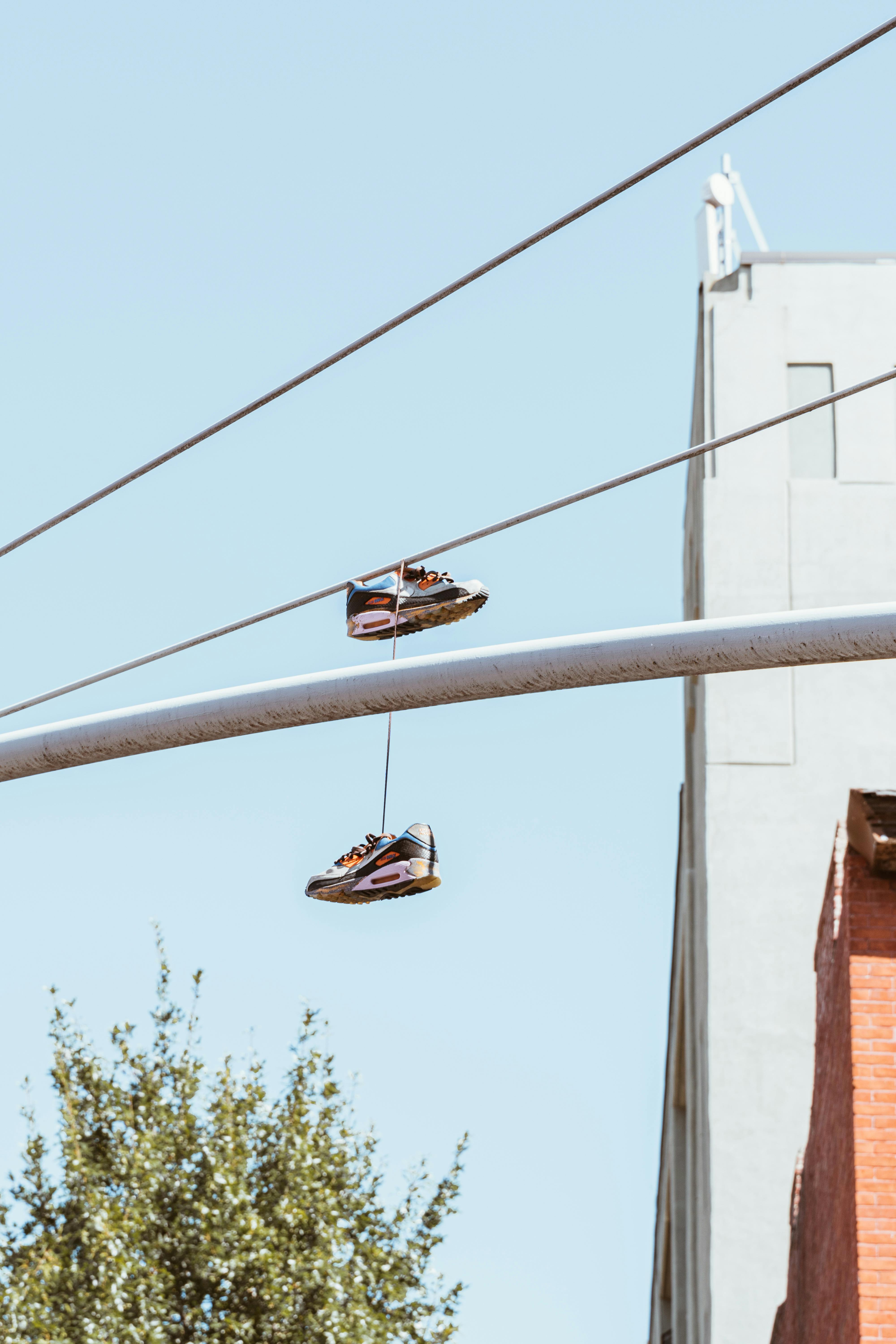 Old Kicks (white sneakers hanging from power lines)