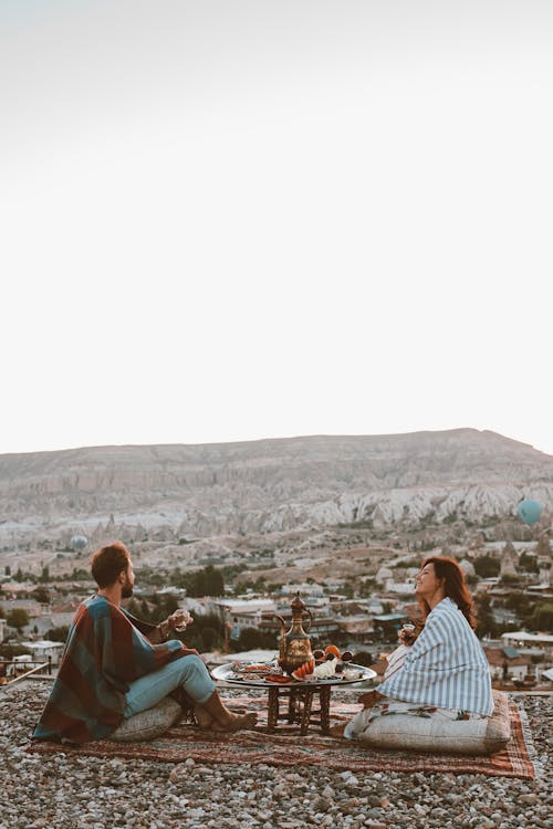 Couple Having Picnic with Scenic View