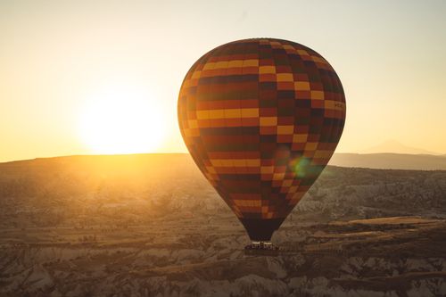 Free Experience a breathtaking hot air balloon flight over Cappadocia at sunrise, capturing scenic views and adventures. Stock Photo