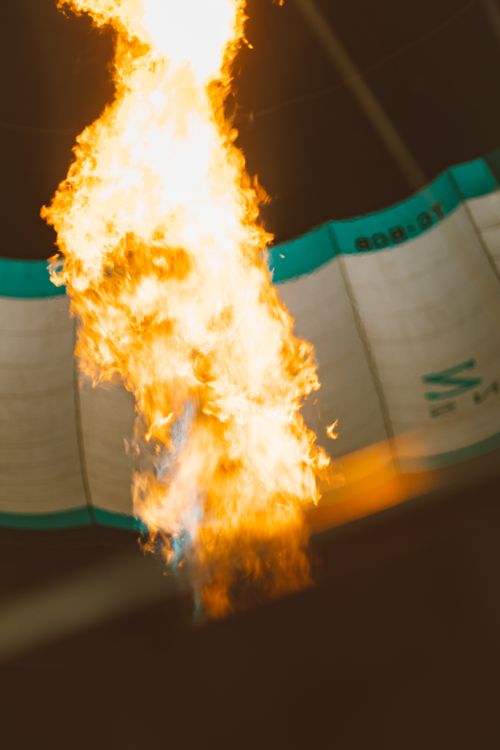 Free Dramatic close-up of a flame inside a hot air balloon, highlighting the heat and energy. Stock Photo