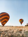 Red and Yellow Hot Air Balloon on Brown Field
