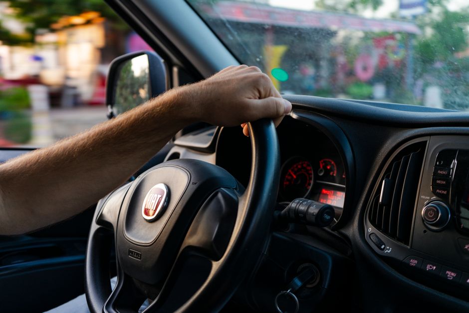driver holding steering wheel