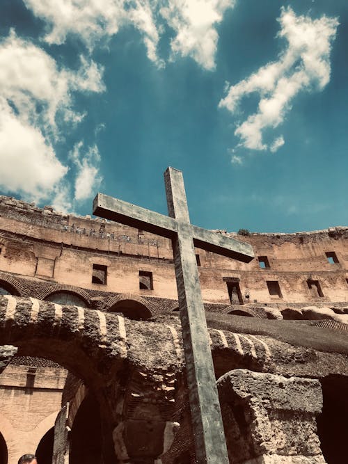 Free Wooden Cross on Ruins against Blue Sky Stock Photo
