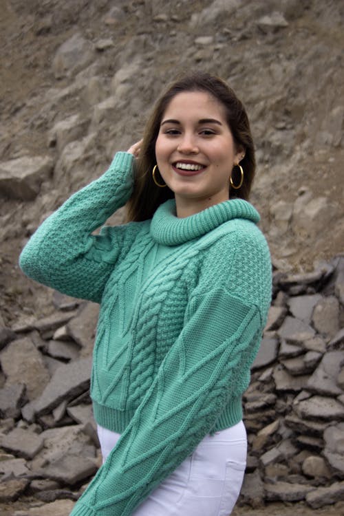 Woman in a Knitted Sweater Smiling