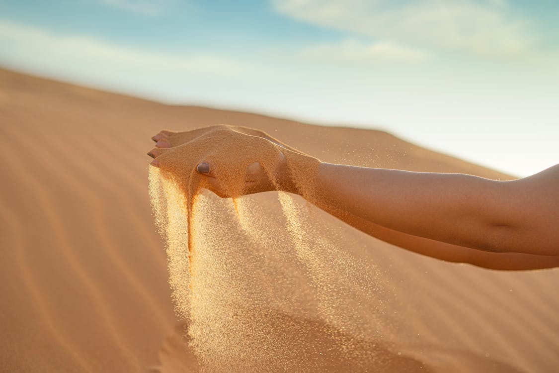 Sand on Person's Hands