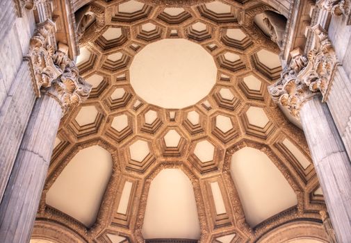 A stunning view of the intricate dome interior of San Francisco's Palace of Fine Arts.