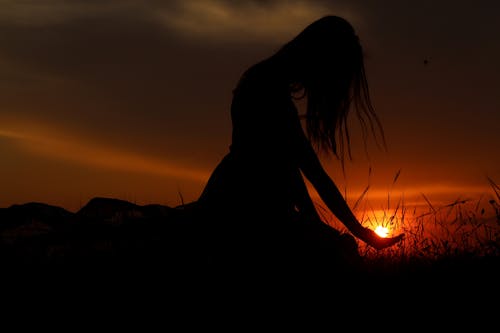 Free Woman's Silhouette during Golden Hour Stock Photo