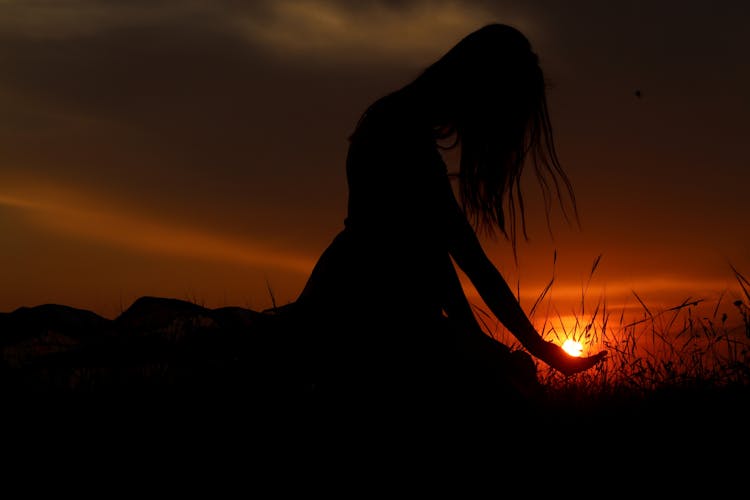 Woman's Silhouette During Golden Hour