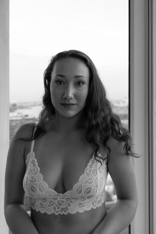 Monochrome Photo of an Alluring Woman in White Laced Lingerie 