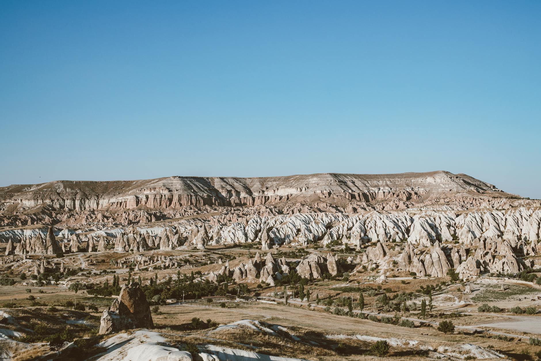 https://www.pexels.com/photo/brown-and-gray-mountains-under-blue-sky-5323469/