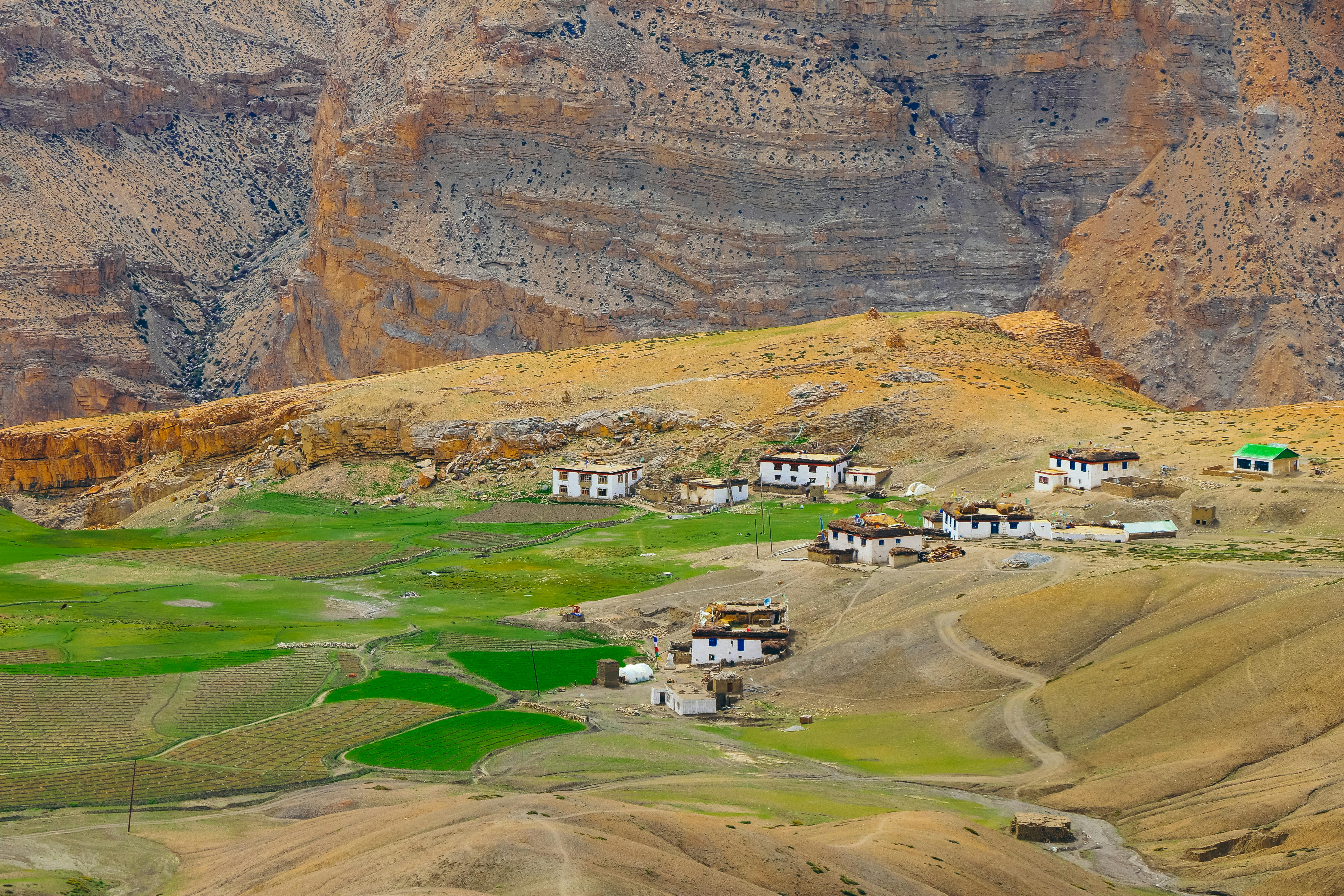 Idyllic view of the rural Langza village amidst mountainous terrain in Spiti Valley, India.