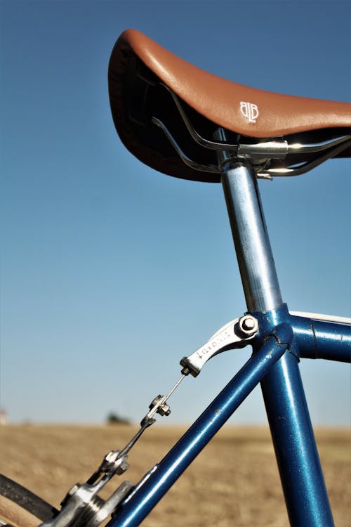 Brown Bicycle Saddle Under Blue Sky
