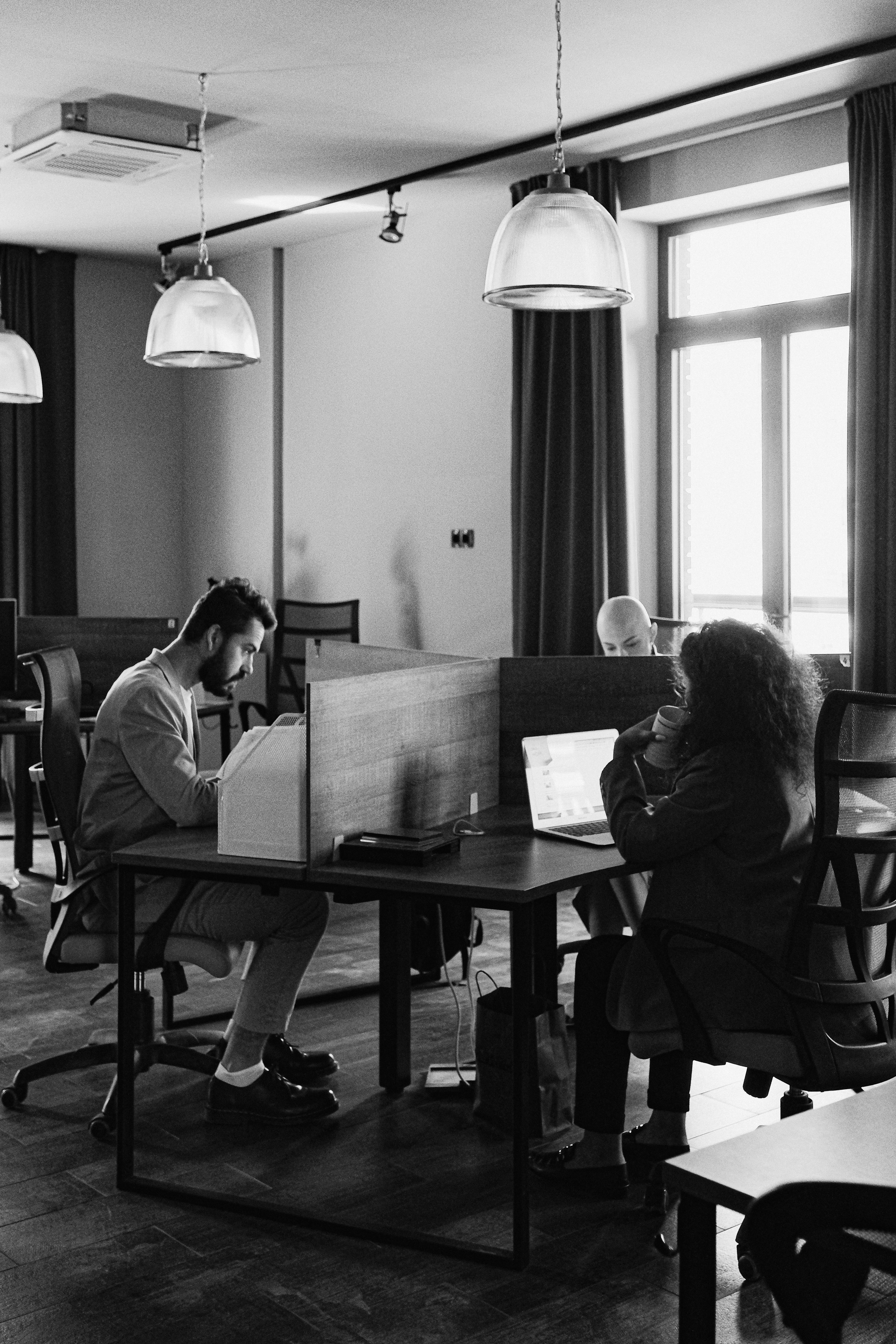 people working in workspace with devices
