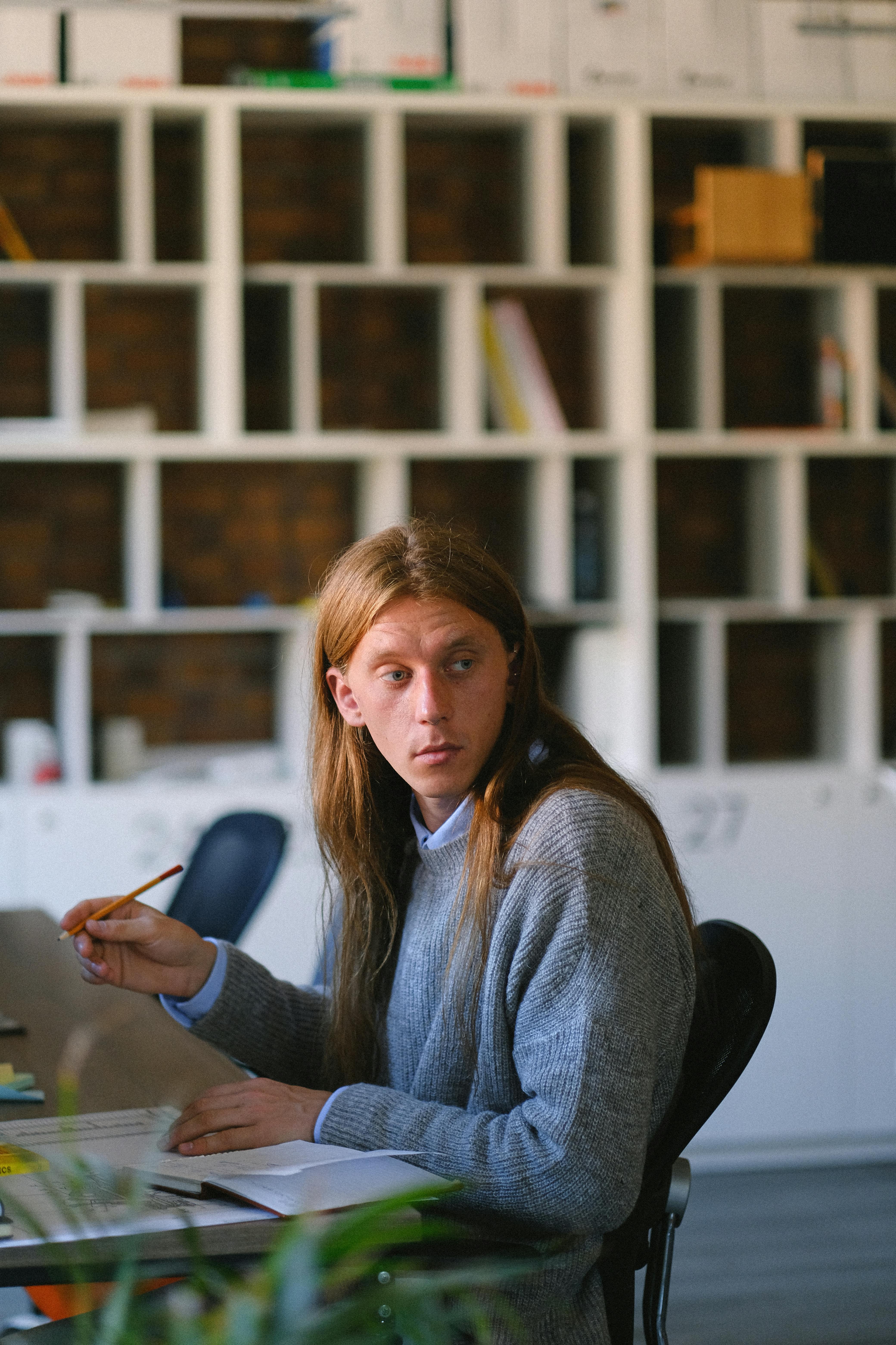 attentive man working with documents in office