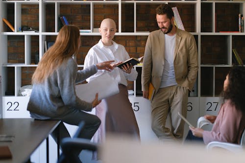 Free Colleagues discussing business issues in creative workspace Stock Photo