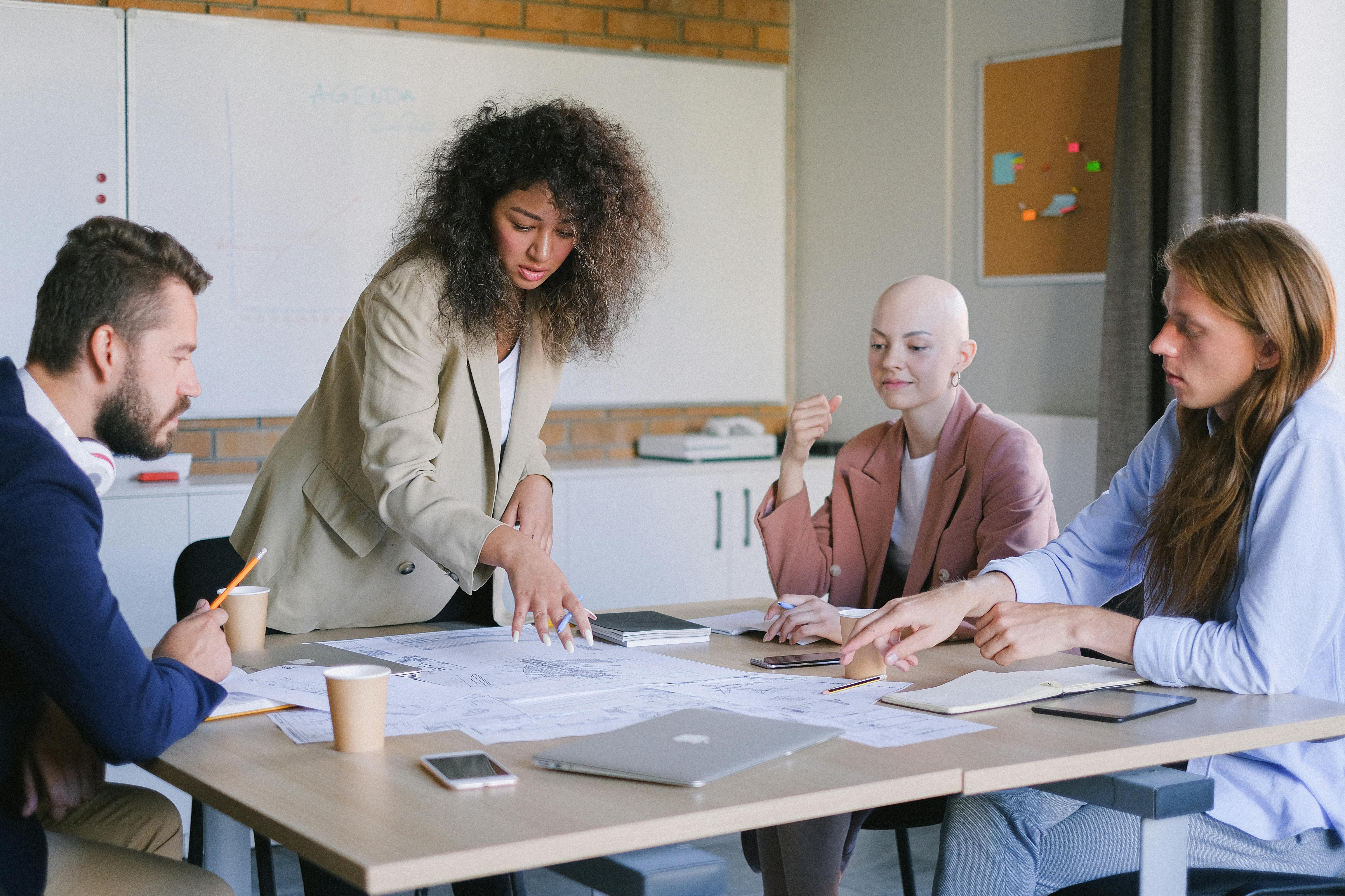 concentrated coworkers having meeting at table