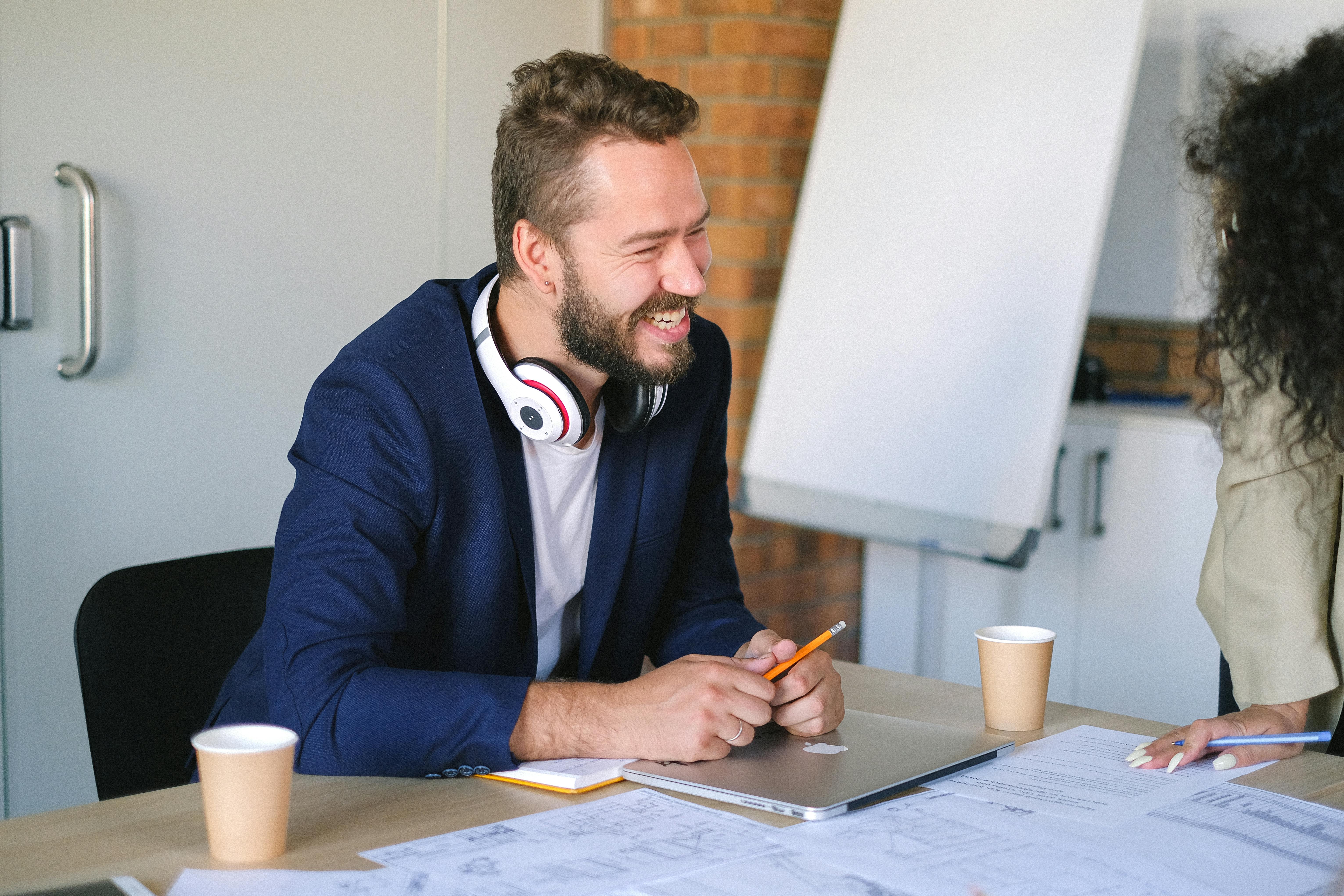 cheerful man working in office