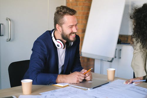 Cheerful man working in office