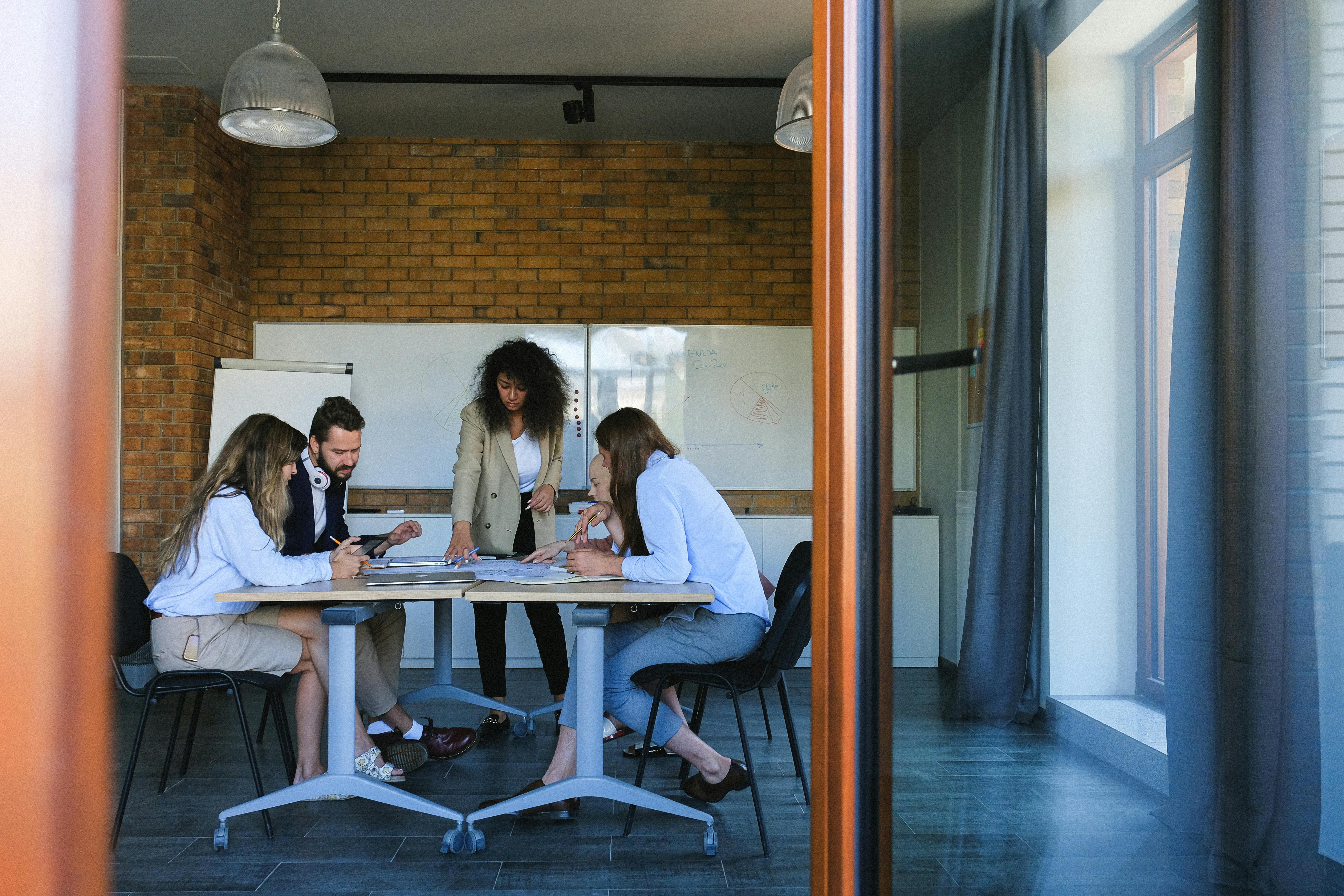 diverse businesspeople talking in modern conference hall