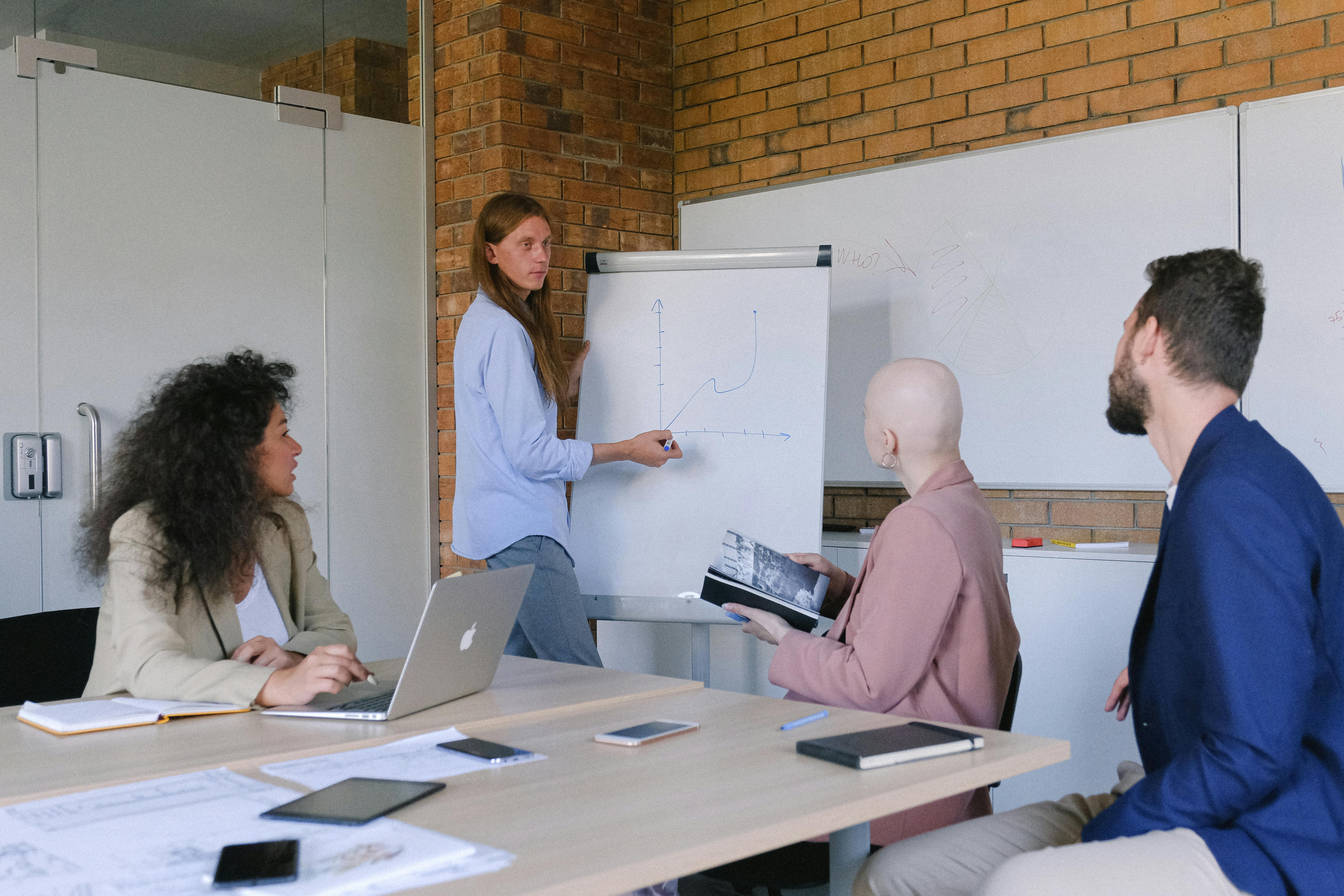 concentrated coworkers sitting on seminar in modern workspace