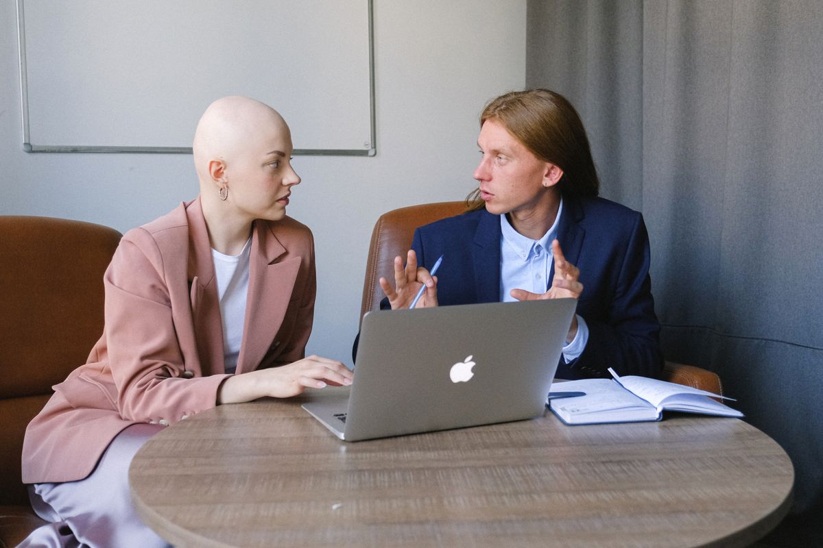 Professional explaining a business strategy clearly to a colleague, a core AI consulting skill