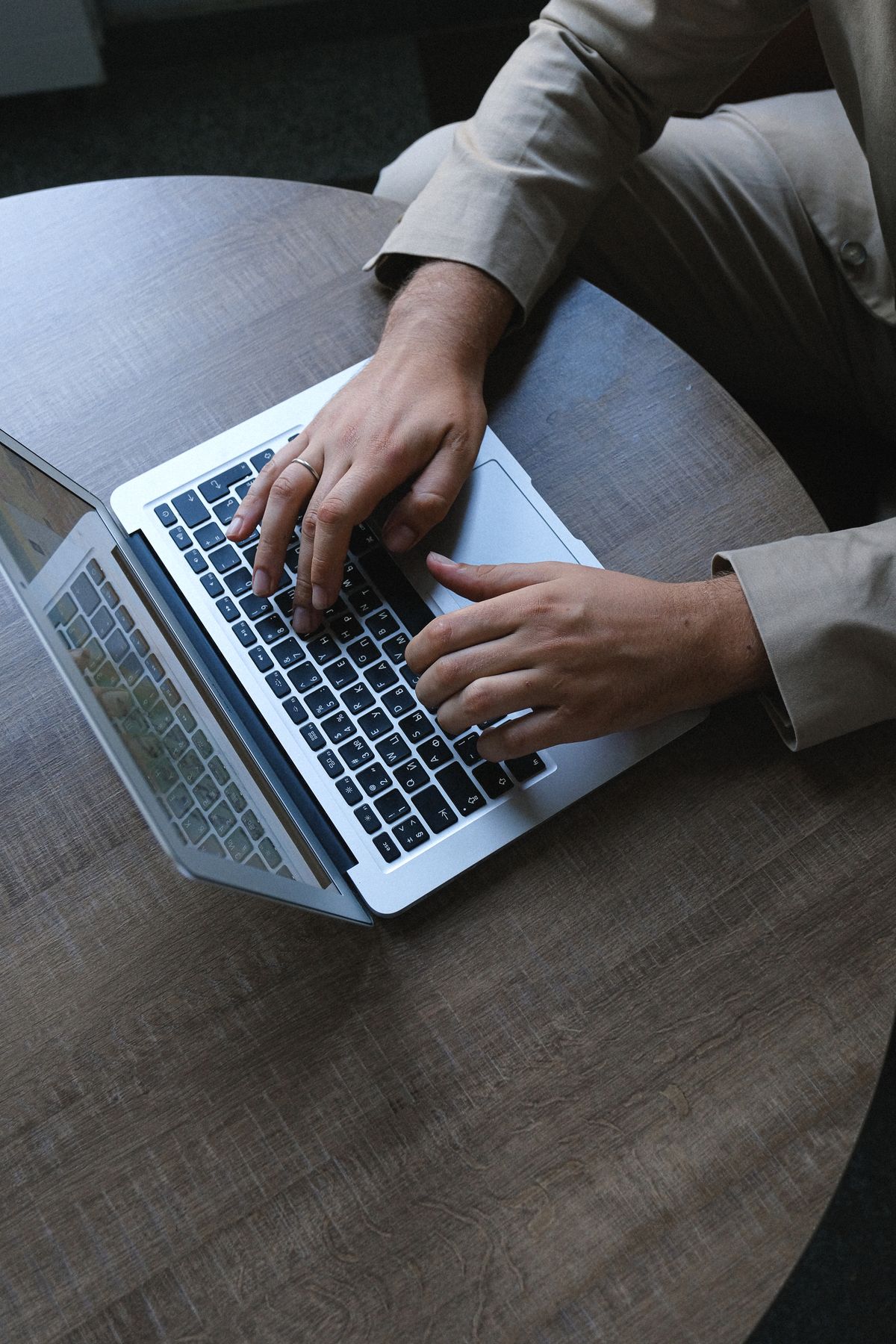 Man working on a laptop in a business office environment