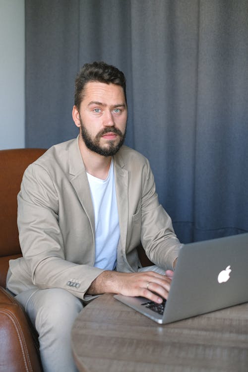 Young man using laptop in office