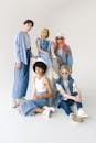 Group of multiethnic models demonstrating casual denim outfits