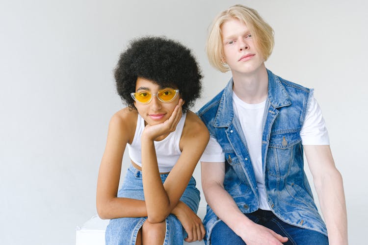 Pensive Multiethnic Couple Looking At Camera