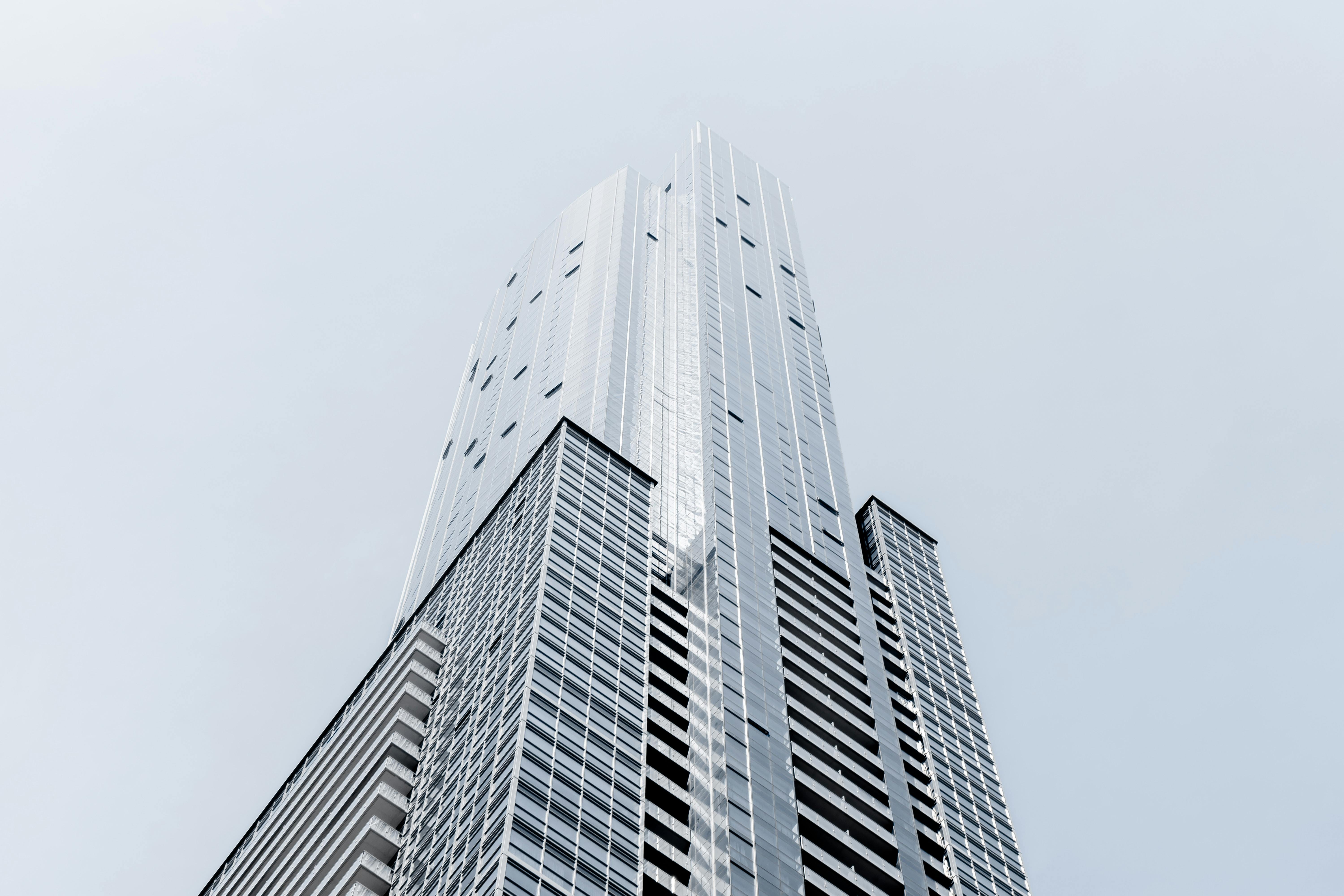 low angle photography of silver high rise building