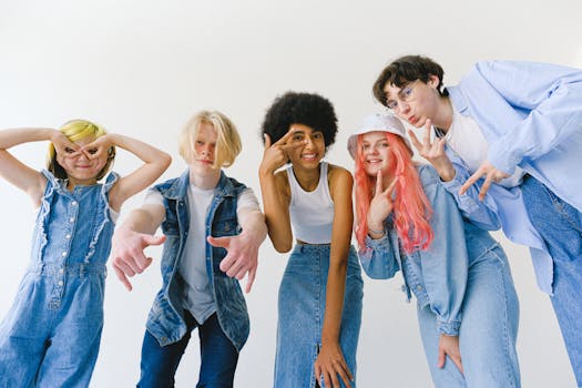 Cheerful group of diverse teenagers expressing joy and friendship in a studio setting.