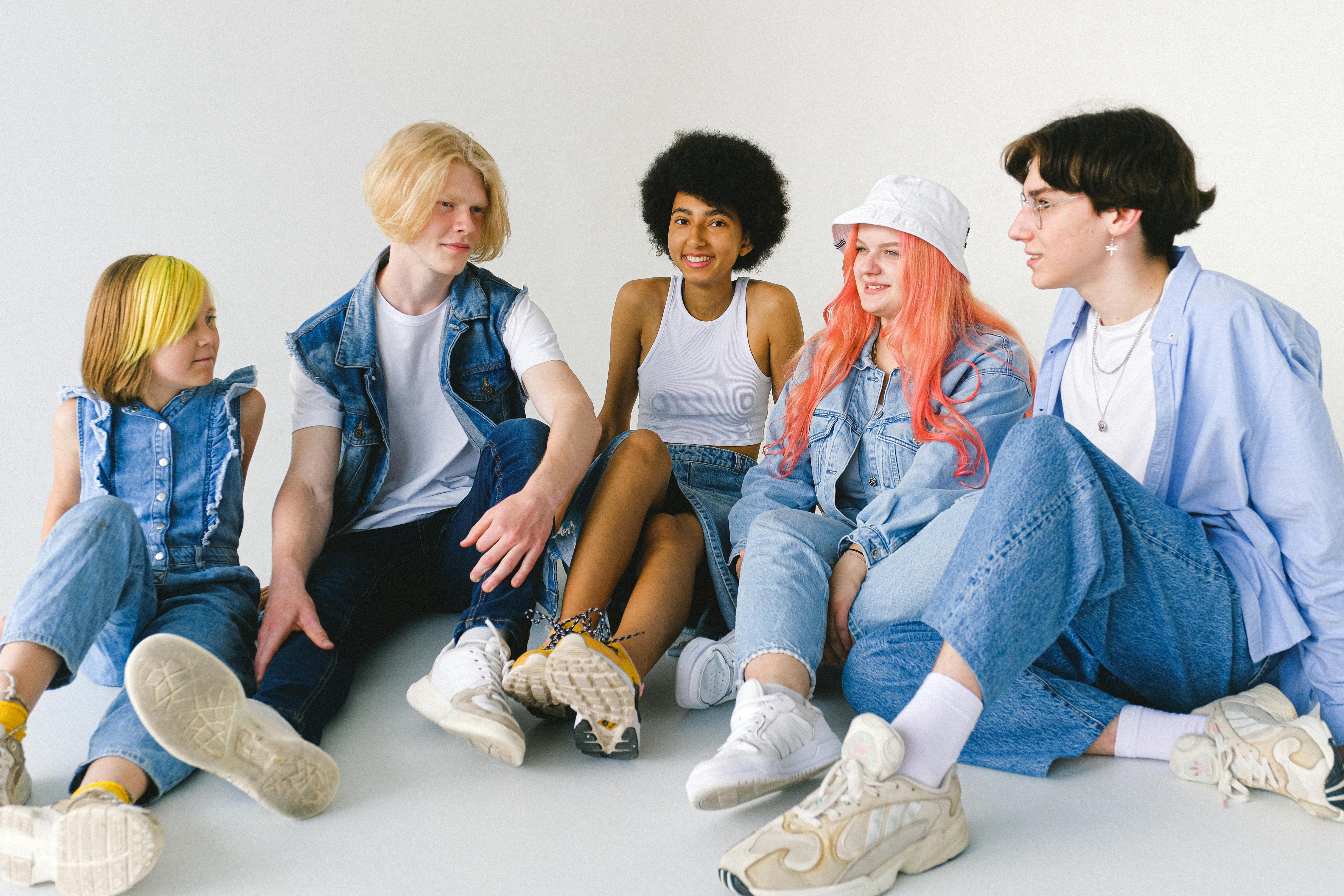 multiracial friends having conversation on floor