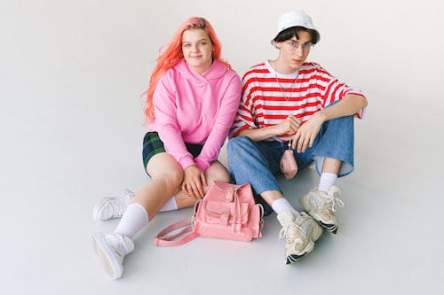 Stylish teenage couple in vivid clothes