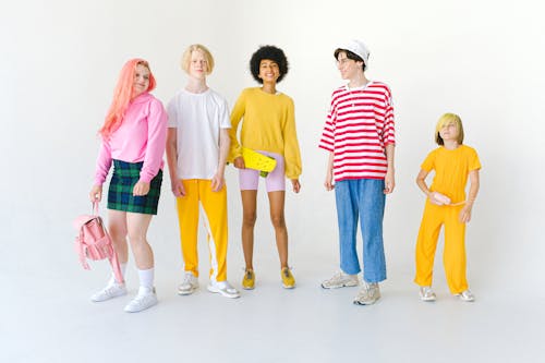 Cheerful diverse friends in colorful wear