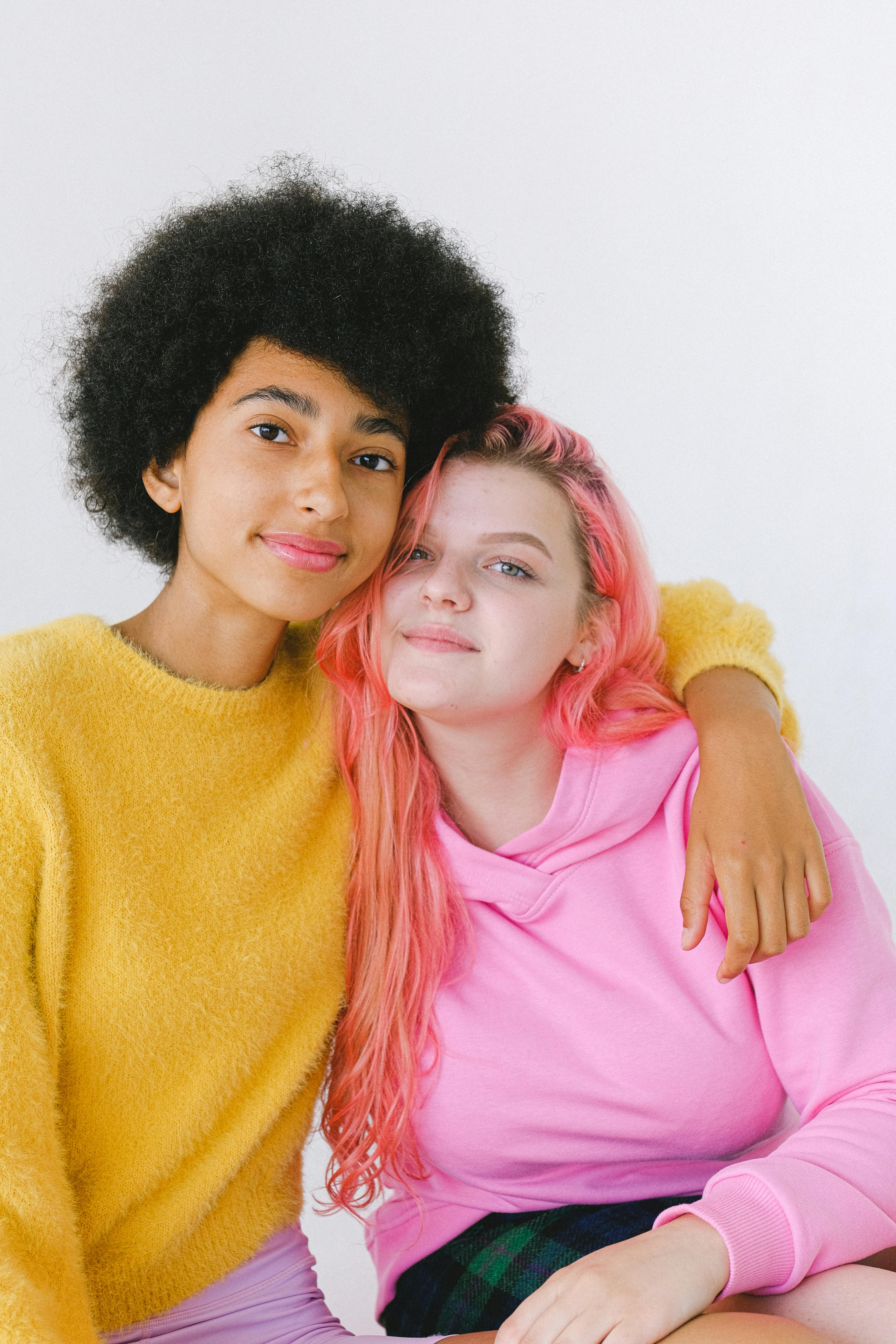 multiracial happy ethnic teen friends in trendy casual outfit