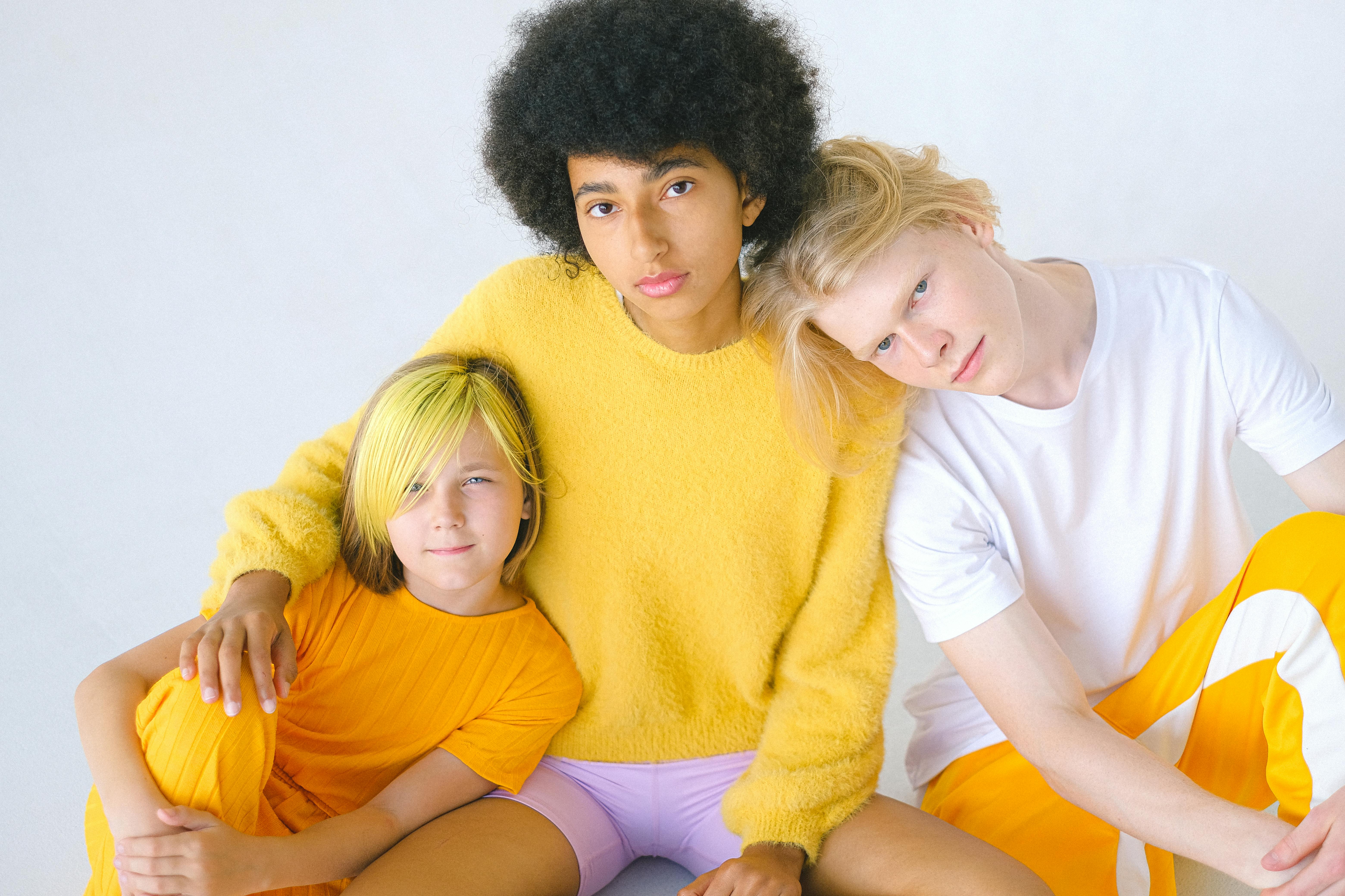 multiethnic carefree teenagers in bright casual outfits