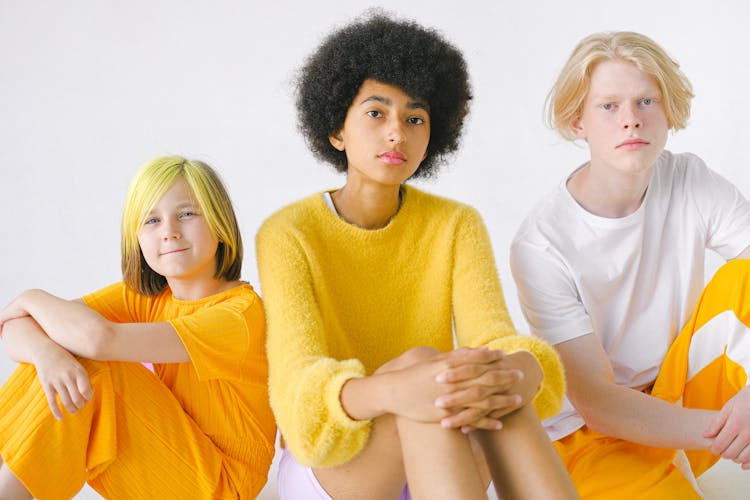 Multiracial Teenage Friends In Bright Clothes