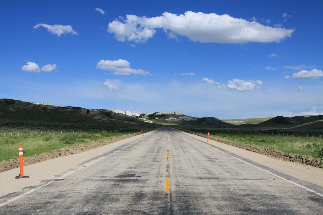 Empty Road Under Blue Sky and White Clouds