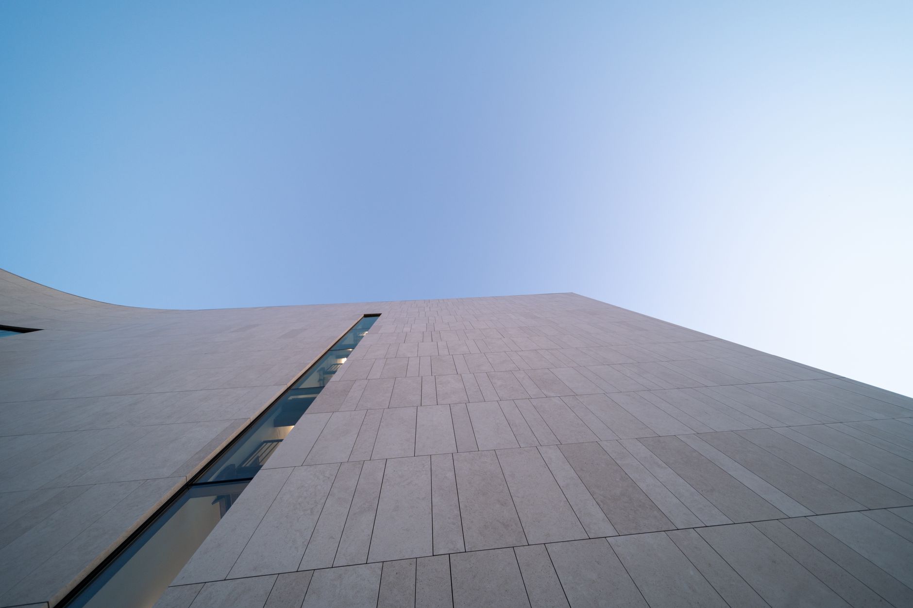 A minimalist architectural detail of a high-end private office, symbolizing institutional stability and global strategic planning.