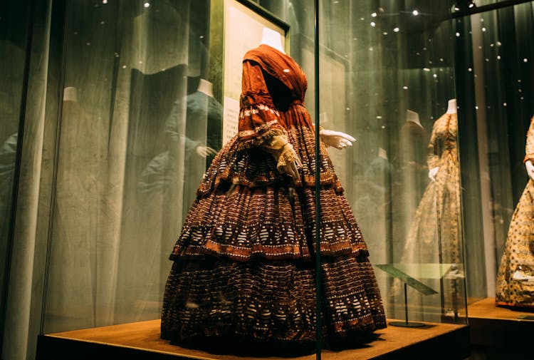 Historical Female Dress On Platform In Showcase