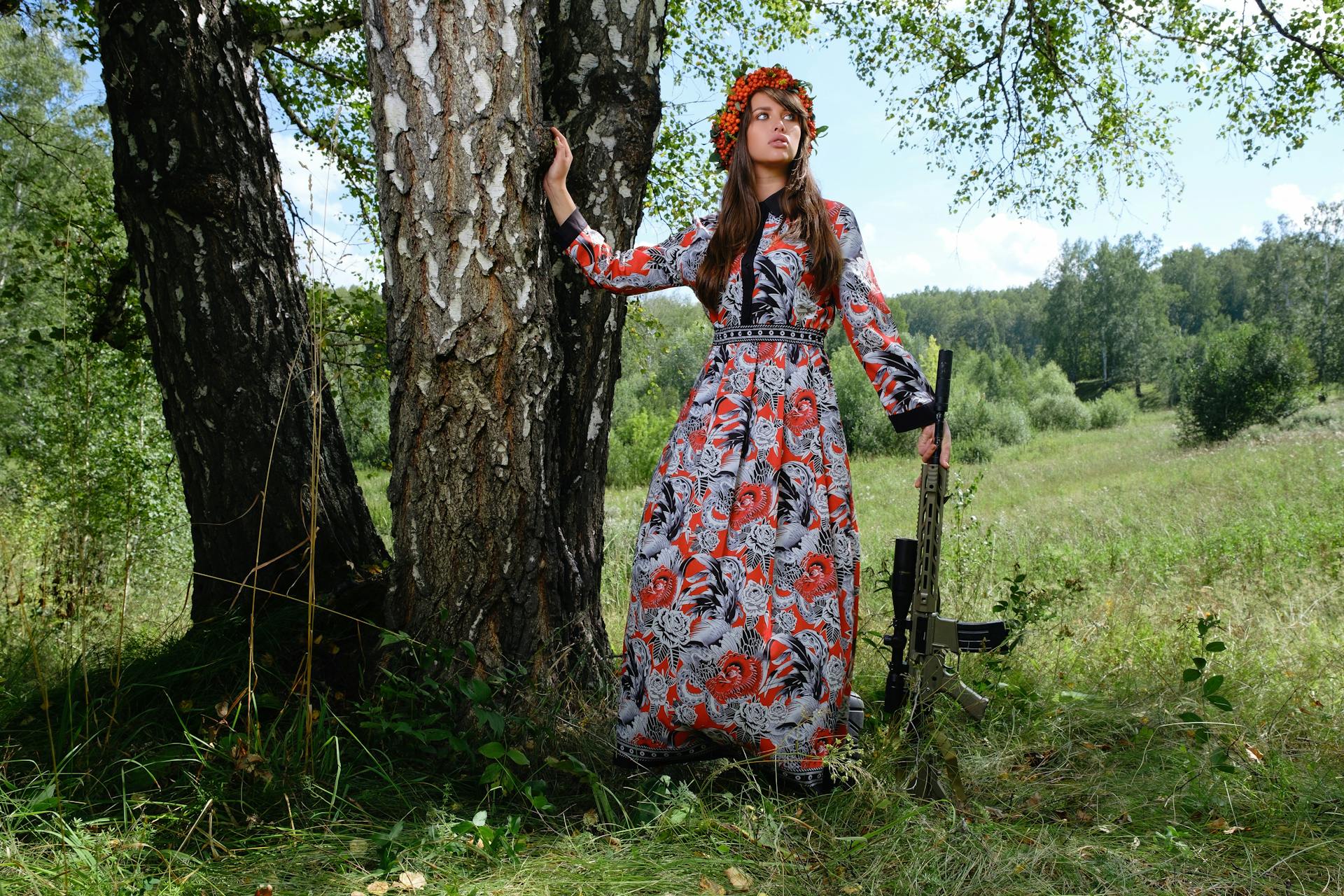 Young woman with rifle ready for revolution