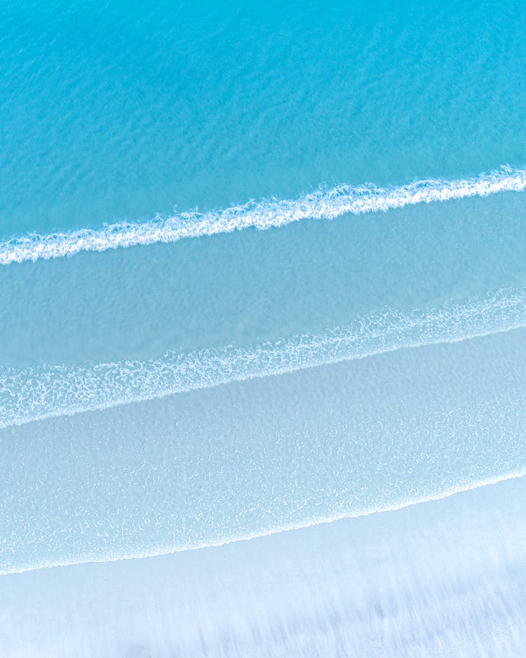 Wavy Tropical Ocean Near Sandy Coast In Summer