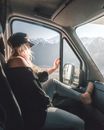 Woman in Black Off Shoulder and Cap Sitting Inside the Car