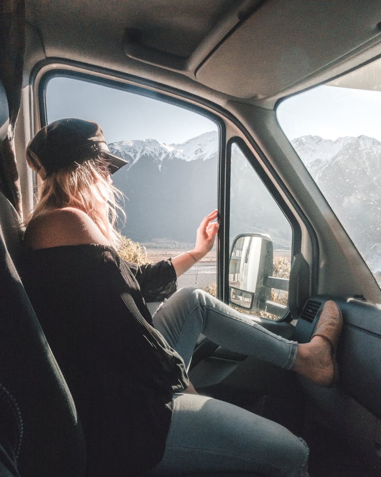 Woman Sitting In Car Looking From Window