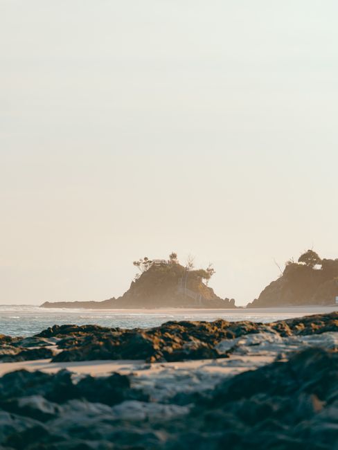Captivating sunrise view of rocky beach at Byron Bay, NSW, Australia, showcasing natural beauty and tranquility.