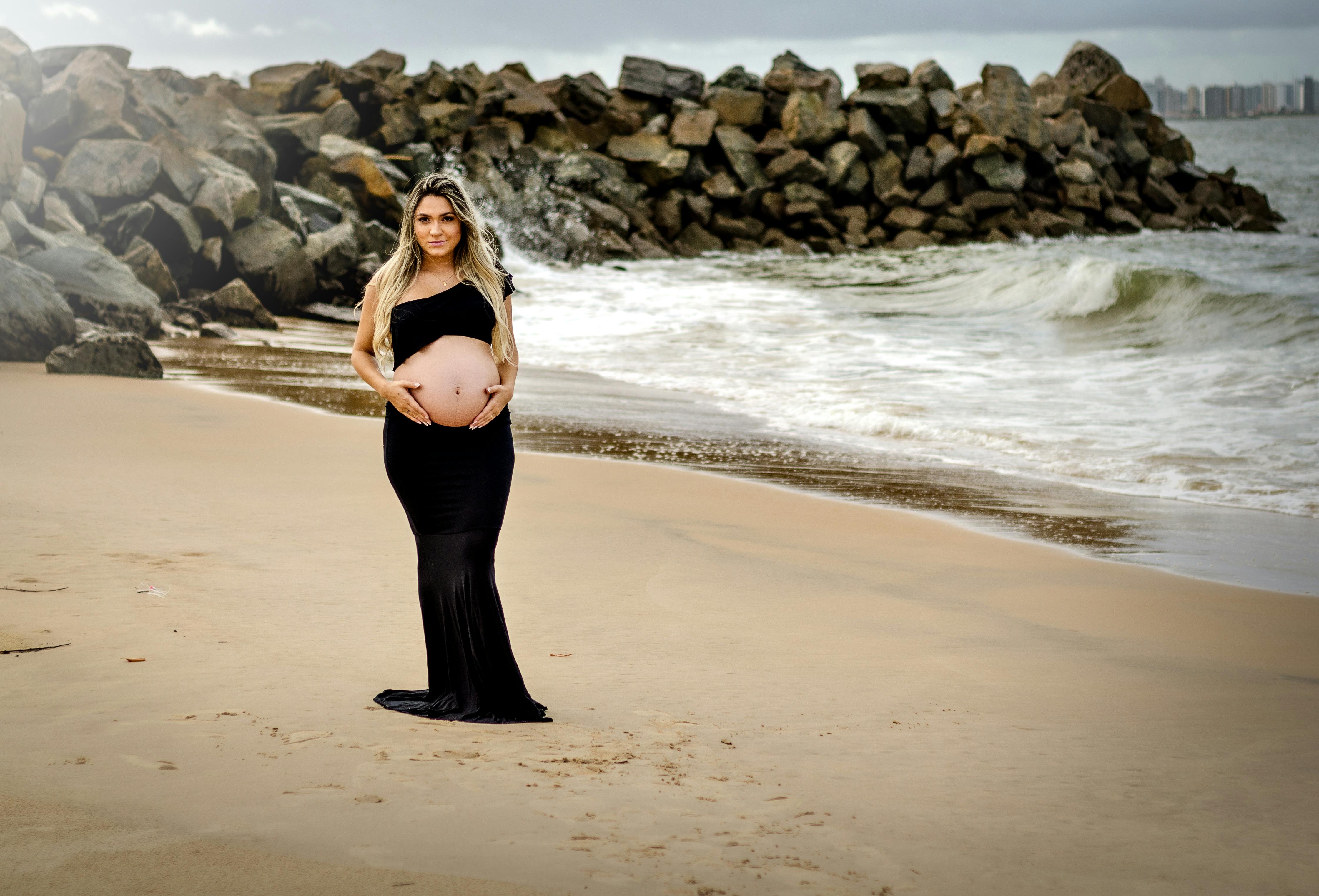 Beautiful Pregnant Woman Standing on The Beach · Free Stock Photo