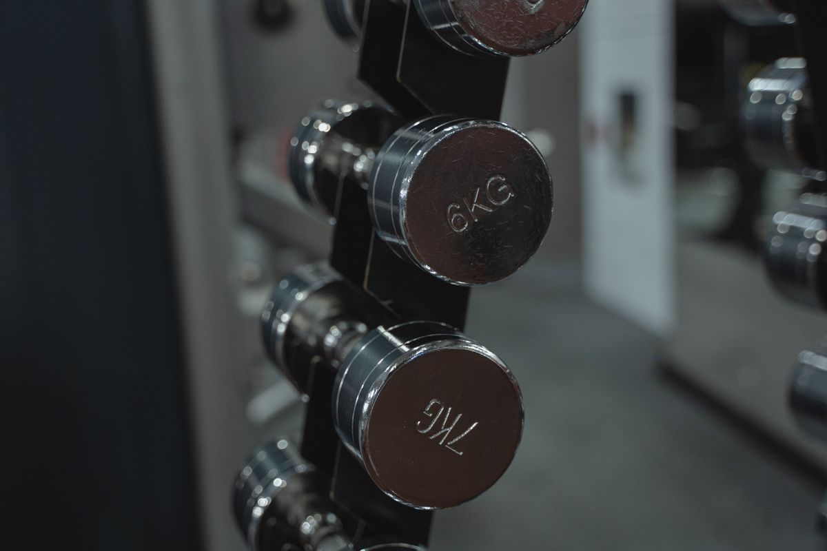 Chrome dumbbells racked in order of weight