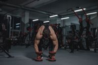 Man in Red Shorts and Red Shoes Doing Push Up